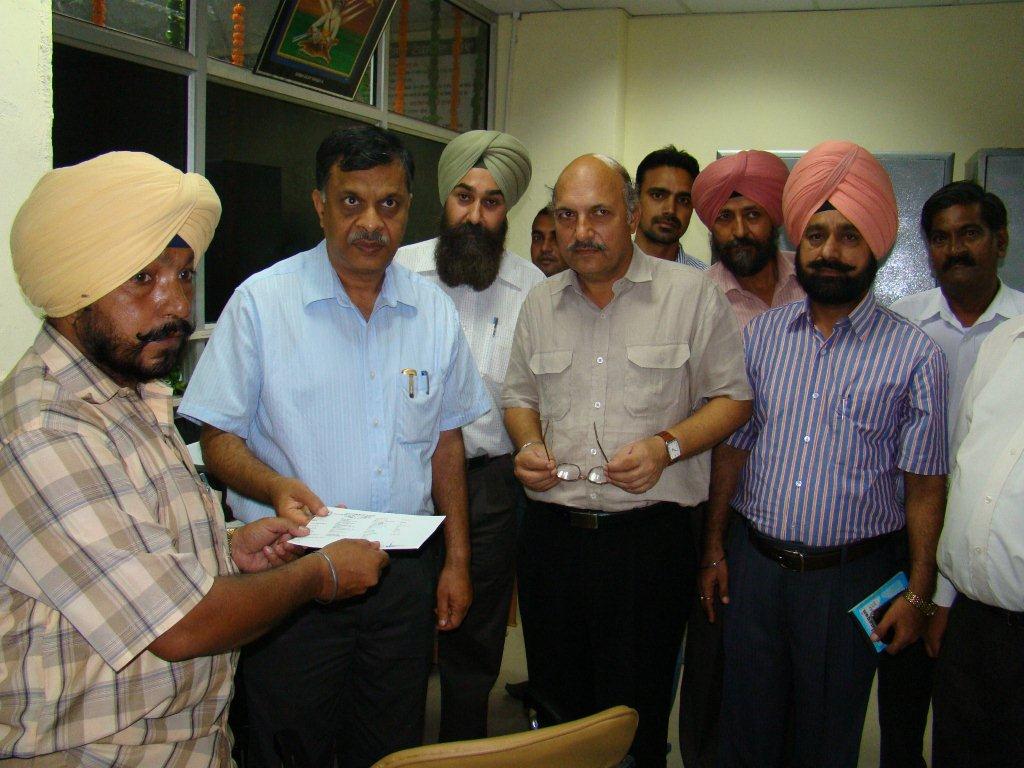 Chief Secretary handing over the first RC to its owner