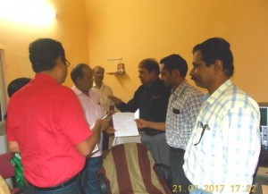 Collector handing over the acknowledgement letter