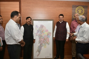 GIS Map of Mumbai region being handed over to Hon. CM in the presence of State Housing Minister, Officers of   Housing department and SIO Maharashtra