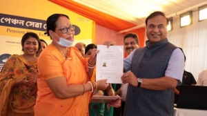 CM Assam hands over Jeevan Pramaan Life Certificate to pensioner