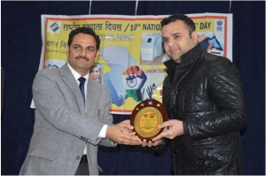 Deputy Commissioner honoring DIO Kathua with  Momento